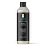 Fles met James Cleansoft reinigingsmiddel voor grondige machinale reiniging van wollen tapijt en meubelstof, zwarte etikettering met blauwgroene en witte tekst.