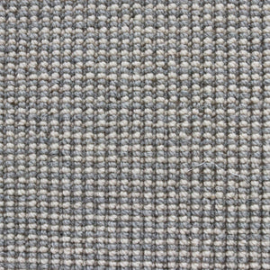 grijs beige tapijt met fijn geweven bolletjesstructuur in een vlak patroon